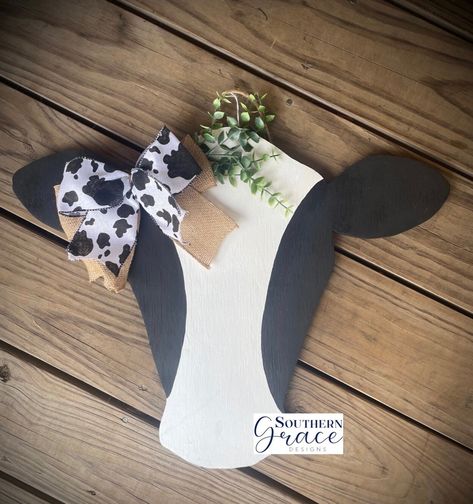 Cow Head Door Hanger | Front Door Decor | Farmhouse Decor | Housewarming Gift | Western Farmhouse Decor 🐮DETAILS: Size: 15inX20in Thickness: 1/2in  Hand painted   🐮PROCESSING/SHIPPING TIMES: - Processing time is 2-3 days. This product is pre made and you will receive the one pictured. Please allow an additional 3-5 business days to receive your item once it has shipped. 🐮These signs are sealed, however they do best for front door use under covered porched or Wall decor 🐮SHIPPING ADDRESS: Please remember to check your shipping address BEFORE submitting your order. Orders will be sent to the address submitted. I am not responsible for non-delivered packages due to incorrect shipping addresses. Join us on Facebook @SouthernGraceDesign3 for new items and discounts! Cow Head Door Hanger Wooden, Cow Head Door Hanger, Western Farmhouse Decor, Front Door Decor Farmhouse, Western Farmhouse, Wooden Wedding Signs, Cow Decor, Family Figurine, Wood Wedding Signs