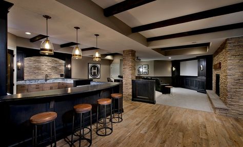 Transitional Man Cave with Morela glass pendant light, Pendant Light, stone fireplace, Barrique series, Wall sconce, Columns Basement Ideas With Fireplace, Red Fireplace Living Room, Man Cave Bar Ideas, Red Fireplace, Transitional Basement, Wainscoting Staircase, Finished Basement Designs, Basement Designs, Wainscoting Bedroom