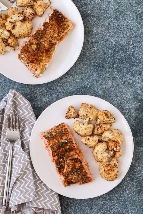 sheet pan salmon and cauliflower with spice rub is an easy weeknight dinner that comes together in 35 minutes with just 7 ingredients. mustard and just 3 pantry spices provide tons of flavor in this healthy recipe. get the recipe now for dinner tonight! Salmon And Cauliflower, Rosemary Salmon, Sheet Pan Salmon, Gluten Free Pesto, Pan Salmon, Leftover Salmon, Head Of Cauliflower, Easy Weeknight Dinner, Spice Rub