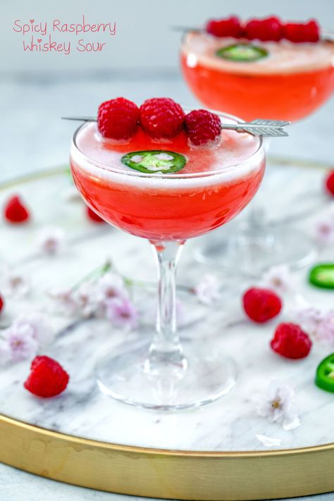 Spicy Raspberry Whiskey Sour Recipe | We are not Martha Raspberry Whiskey Drinks, Raspberry Sour Cocktail, Flower Drinks, Rye Whiskey Cocktail, Homemade Whiskey, Whiskey Sour Cocktail, Healthy Cocktail Recipes, Whiskey Sour Recipe, Flavored Alcohol