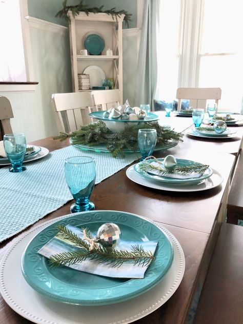 The table was set! Each of the 12 place settings received a white charger, turquoise ceramic plate, matching water goblet, striped water colored napkins and a fresh sprig of pine. There were extra bulbs which I then tied to a sprig with twine and placed them in the center of each dinner plate. Teal Plates Table Setting, Turquoise Table Decor, Teal Table Setting, Turquoise Table Setting, Dining Room Furniture Makeover, Kitchen Plates Set, Dining Room Transformation, Ceramic Kitchenware, Furniture Transformation