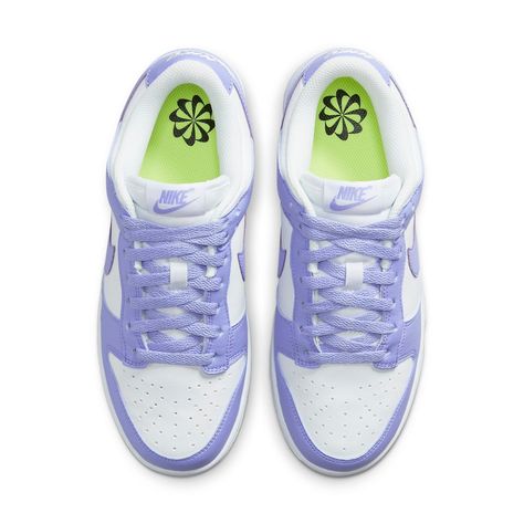 Take a step back in time while freeing the environment from some of its human-caused burden with the Nike Dunk Low Next Nature Lilac Women. Crafted with 20% recycled materials, these eye-catching shoes provide an inspiring take on retro style. The upper is designed using white leather and punctuated with perforated toe box for added breathability. Violet hues appear throughout, tinting the overlays and laces as well as adding a subtly branded touch via a purple Nike label on the tongue. To complete the look, the heel has an embroidered white Nike logo and volt insole sets off a black pinwheel against the white rubber midsole. This eco-friendly masterpiece comes together with a stunning purple Grind outsole—an inimitable combination of athletic style and sustainable design. With fashion tre Nike Dunk Low Next Nature, Trendy Shoes Sneakers, Preppy Shoes, Pretty Shoes Sneakers, Nike Sale, Nike Models, Womens Air Jordans, Limited Edition Sneakers, Cute Nike Shoes