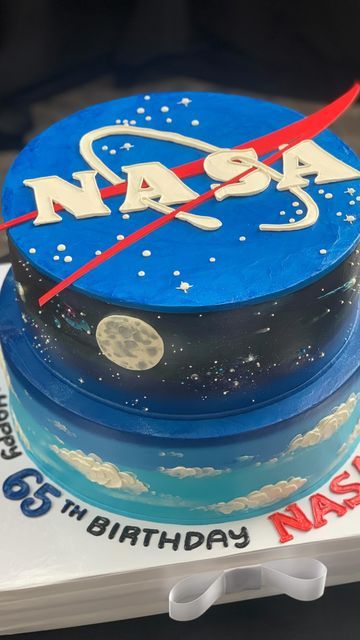 The White Flower Cake Shoppe on Instagram: "We were honored to create this stellar BUTTERCREAM cake for @nasaglenn !  Celebrating the 65th Birthday of their iconic logo, designed in #Cleveland by the late #NASA employee James Modarelli.  We had an amazing time touring the @nasaglenn facility! Thank you for this incredible opportunity!  #whiteflowercakeshoppe #buttercreamcake #buttercteamlove #clecakes #clevibes #cakeoftheday #lovewhatwedo #moon #nasa #space #stars #westsidemarket #eton #solon #strongsville" Nasa Cake, White Flower Cake Shoppe, 65th Birthday, Round Cakes, Buttercream Cake, Flower Cake, Nasa, Cake Designs, White Flowers