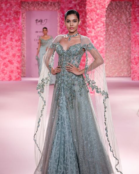 "Martine" Jacket Lehenga Powdery sage with deep teal accents and crystallized embroidered Jacket paired with chikankari lehenga and accentuated with cape sleeves Available at Delhi and Mumbai Store. Jewellery Partner: @shailjas_naturaldiamonds Shoe Partner: @venussteps Gift Partner: @smokelabofficial Celebration Partner: @cedarclubhouse Photography : @gesuseth @hyundaiindia @reliancebrandsitd @lotus_herbals #FDCI #HyundailndiaCoutureWeek #ICW2024 #Hyundai #RelianceBrandsLtd #MakingOfTheC... Beige Lehenga, Jacket Lehenga, Chikankari Lehenga, Teal Accents, Cape Sleeves, Braids For Long Hair, Deep Teal, Embroidered Jacket, Fashion Outfit