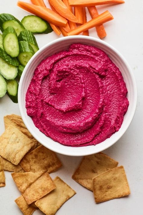 This bright and creamy beet hummus is made with roasted beet, chickpeas, tahini, garlic and lemon. It’s subtly sweet, full of flavor and super easy to whip up. Serve it as a healthy appetizer or snack with veggies, crackers or pita or use it as a sandwich spread. Beet Hummus Recipe, Healthy Appetizer, Beet Hummus, Pickled Beets, Sandwich Spread, Healthy Appetizers, Chickpeas, Tahini, Beets