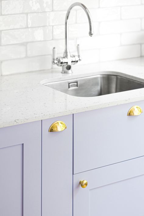 There's a definite trend towards adding colour to a kitchen   This beautiful lilac kitchen in our Bloomsbury project shows how colour doesn't need to be scary   The draw fronts are in a beautiful lacquered pale lilac, with gold handles and drawer pulls, a soft grey composite worktop and hand glazed high gloss rectangular tiles for the backsplash   For more design details and tips see our website Lilac Kitchen, Lavender Kitchen, Rectangular Tiles, Hallway Paint, Joinery Design, Pale Lilac, London Interior, Home Automation System, Gold Kitchen