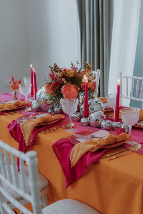 Stylish Pink & Orange Wedding Tablescape Groovy Wedding Table Decor, Pink And Orange Wedding Nails, Pink Orange Dinner Party, Pink And Orange Wedding Table Setting, Pink And Orange Wedding Reception, Orange Pink And Red Wedding, Pink And Orange Hens Theme, Hens Party Decorations Ideas, Hens Table Decorations