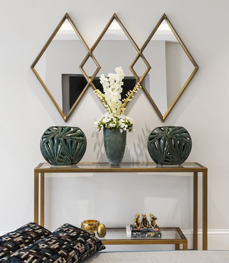 A statement feature within our recent Bellis Homes design, this overlapping diamond mirror with geometric antique brass-finished frame marries boldly with the deep green to create a very trendy, vintage retro look. Console Mirror Design, Wall Mirror Design Ideas, Mirror Design Ideas, Living Room Wall Mirror, Wall Mirror Design, Modern Mirror Design, Room Wall Mirror, Mirror Interior Design, Interior Design London