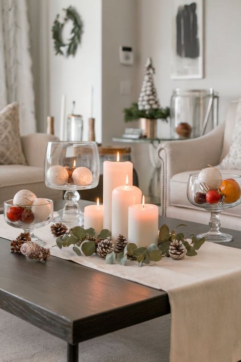 A neutral holiday coffee table arrangement with candles, pine cones, and simple greenery for an elegant festive centerpiece. Holiday Coffee Table Decor, Holiday Coffee Table, Table Decor Inspiration, Neutral Holiday Decor, Holiday Decor Ideas, Neutral Christmas Decor, Decor For Christmas, Coffee Table Decor, Holiday Coffee