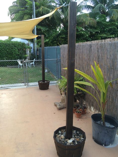 Here's a post we made out of barrels, concrete, a couple brackets, 7 foot 4x4 and some stain. Wooden Fence Design, Backyard Wood Fence, Stain Deck, Wood Fence Ideas, Backyard Lighting Diy, Gazebo Backyard, Party Backyard, Backyard Oasis Ideas, Backyard Beach