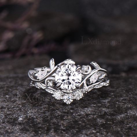 Item description ✦ Handmade, high-quality item! ✦ Material: 925 Sterling Silver, Solid 10k/14K/18K GOLD (can be made in white/rose/yellow gold) Engagement ring ✦ Center stone: Moissanite or Lab Grown Diamond with IGI Certificate (International Gemological Institute) ✦ Size/Weight: 6.5mm Round Cut ✦ Side stones: Round Cut and Marquise Cut Moissanites or Lab Grown Diamonds Wedding bands ✦ Gemstones: Round Cut Moissanites or Lab Grown Diamonds Any ring size can be made,if the ring size is not in th Nature Inspired Wedding Ring, Floral Wedding Bands, Pretty Engagement Rings, Nature Inspired Wedding, Moissanite Engagement Ring Set, Cute Engagement Rings, Future Engagement Rings, Dream Engagement, Dream Engagement Rings