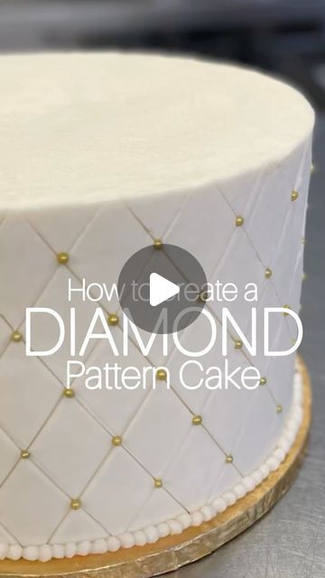 ALISHA NUTTALL on Instagram: "💎Creating a diamond pattern cake is super easy!  •Start with a frosted, frozen cake. •Lay a diamond impression mat on the cake. •Usinf a smoothing tool to create lines into it. •Enhance the lines with a bench scraper for added depth. •Place edible pearls at each corner. •Finish by piping frosting pearls along the edges.  And now you have a 💎DIAMOND pattern cake!" Diamond Shaped Cake, Simple Wedding Cake With Pearls, Diamond Cake Design, Diamond Cake Ideas, Cake With Diamonds, Pearl Cake Design, Frosting Patterns, Cakes With Pearls, Diamond Wedding Anniversary Cake