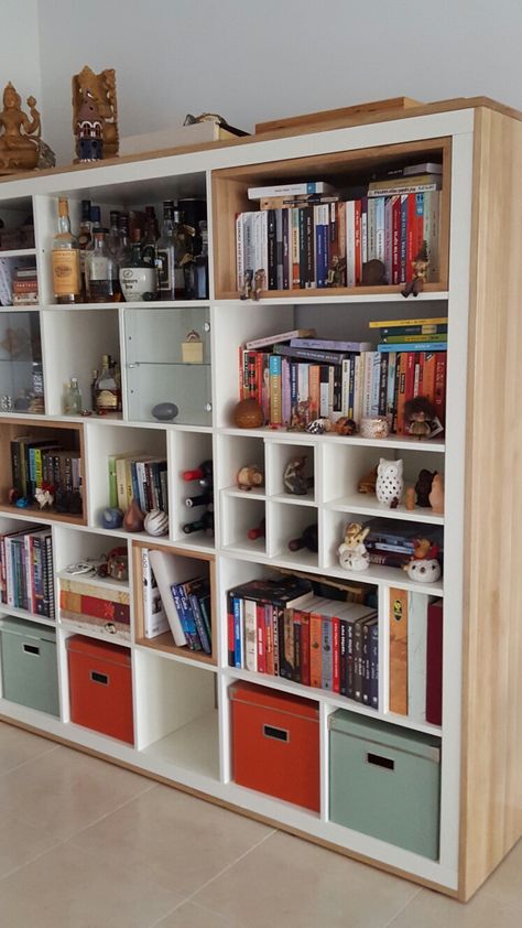 Ikea 5x5 Expedit storage unit  Inner divisions changed and wood added around and inside a few cubes 5x5 Kallax Ideas, Kallax 5x5 Ideas, Kallax Oak, Kallax 5x5, Partition Design Modern, Ikea Kallax Bookshelf, Ikea Cubes, Modern Partition, Kallax Hack