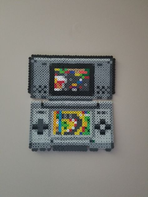 OG Nintendo Ds with a minimalist rendition of Mario Kart ds on the screen - Imgur Nintendo Perler Beads, Nintendo Perler Bead Patterns, Nintendo Switch Perler Beads, Perler Beads Mario Cart, Nintendo Perler, Mario Kart Ds, Melty Beads, Nintendo Ds, Mario Kart