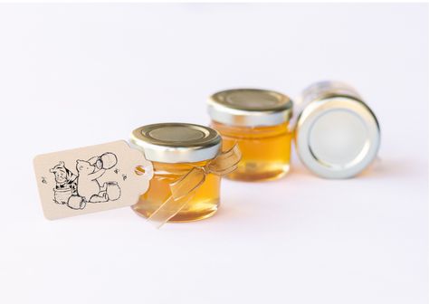 Mini honey jar favors for Winnie the Pooh themed baby showers. For unique and thoughtful favors for a baby shower, consider the sweet taste of honey. Our honey comes from the blossoms of the Pacific Northwest (most of our honey comes from wildflowers and berry blossoms). PLEASE READ BEFORE PURCHASING: FAQ How are these favors shipped? The tags come ready for you to attach with ribbon that is cut to the correct length. Tags are not attached prior to shipping; this is to ensure they don't get crushed during shipping. How big are the jars? The jars are 1.75 x 2 inches.  How soon should I order? Although great care is taken to package items carefully, glass jars are fragile. We will replace any jars that are damaged during the shipping process. Place your order early enough so that there is ti Mini Honey Jar Favors, Chinese Wedding Favors, Honey Jar Favors, Double Happiness Symbol, Honey Favors, Honey Jars, Bee Sticker, Double Happiness, Honey Jar