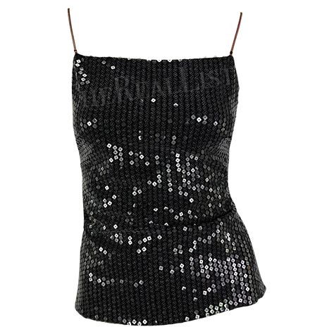 Presenting a fabulous black rhinestone Gianni Versace tank top, designed by Donatella Versace. From 1999, this top is covered in transparent sequins that perfectly catch the light with every movement. The top features a square neckline, and metal rose gold-tone straps, and is made complete with a strap that wraps around the back and is accented with a Versace Medusa relief hook. Never worn before, this top comes with the original brand tags still attached from over 20 years ago! Approximate meas Gianna Versace, Versace Clothes Women, Versace Outfit Women, Sequin Black Top, Versace Clothes, Versace Tops, Versace Top, Fancy Fits, Black Sequin Top