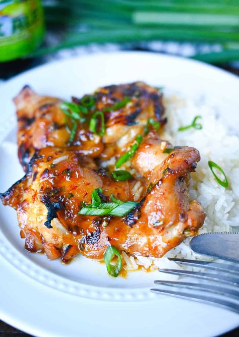 Peach chipotle chicken placed on top of coconut rice on a white plate. Chicken With Coconut Rice, Chipotle Recipes Chicken, Peach Chicken, Coconut Chicken, Chipotle Chicken, Large Crowd, Peach Recipe, Coconut Rice, Chicken Dishes Recipes