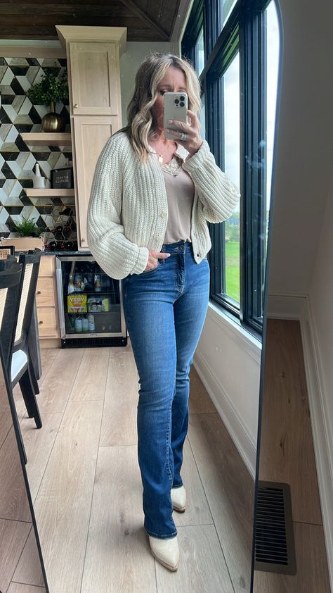 Cream cardigan sweater, bootcut jeans Fall Outfits Women Bootcut Jeans, Bootcut Jeans And Sweater Outfit, Bootcut Jeans With Sweater, Thanksgiving Outfit Bootcut Jeans, Outfit Ideas With Bootcut Jeans, Bootcut Jeans Sweater Outfit, Casual Mid-rise Winter Flare Jeans, Snowday Outfit, Bootcut Jeans Outfit Fall