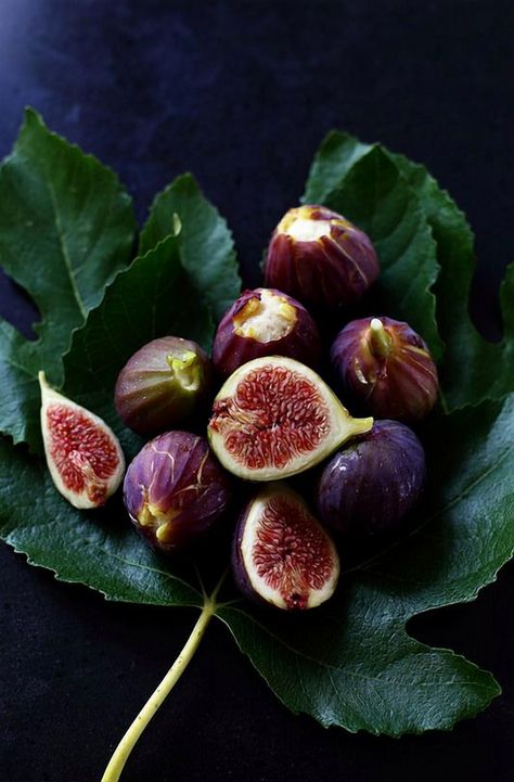 Embrace the beauty of autumn with a stunning display of fresh figs resting elegantly on a lush green leaf. This harvest arrangement not only captures the essence of the season but also offers a delightful treat for the senses. Perfect for adding a touch of natural elegance to your table setting or as a centerpiece for your fall gatherings. Let the rich colors and textures inspire your next culinary creation or simply enjoy the visual feast. Harvest Display, Tapas Party, Wholesome Snacks, Beautiful Desserts, Fresh Figs, Snack Options, Natural Sugar, Green Leaf, Lush Green