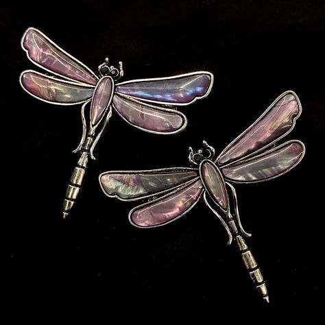 "Pieces are attached using a special jewelry adhesive. Please read descriptions thoroughly for sizes and materials.  This is a silver metal alligator hair clip featuring a stunning silver metal dragonfly with abalone or mother of pearl in pink, and purple on the wings and body, with highlights of blue and green. You can select from one that goes on the right side of your head or the left! I also love clipping these to my purse strap or on my clothes! It is a really fun way to dress up any hair style, and especially eye catching for a formal hair style at prom or a wedding. Just over 2\" long and just over 2 1/4\" wide.  Make sure to check out my shop for more hair pins, jewelry, accessories, and all sorts of fun stuff! Please note that a special jewelry adhesive is used to adhere the ornam Dragonfly Accessories, Dragonfly Fashion, Dragon Fly Hair Clip, Dragonfly Hair Clip, Metal Dragonfly, Metal Hair Accessories, Purple Dragonfly, Vintage Handmade Dragonfly Necklace, Pink Dragonfly