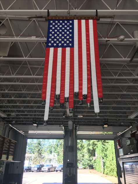 Fire hose flag. Fire Station Decor, Fire Hose Flag, Fire Hose Decor, Firehouse Decor, Fire Hose Projects, Fire Hose Crafts, Fire Dept Decor, Fire Department Decor, Fire Decor