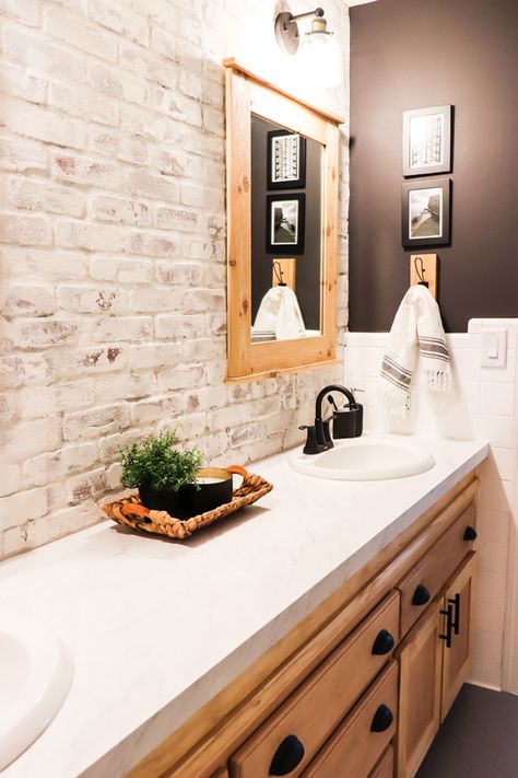 When we made over the boys bathroom, I knew I wanted a showstopper. Here's how to install and limewash brick veneer accent wall. Faux Brick Wall Bathroom Master Bath, Faux Brick Wall Bathroom Ideas, Brick Tiled Bathrooms, Whitewash Brick Bathroom, Shiplap And Brick Bathroom, Faux Brick Wall In Bathroom, Painted Brick Bathroom Wall, Brick And Shiplap Wall Bathroom, Faux Brick In Bathroom