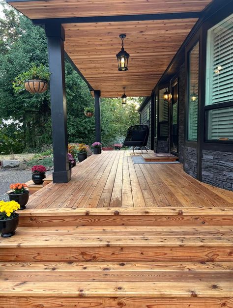 Exterior Accent Wall Ideas, Cedar Front Porch Ceiling, Wood Soffit Porch, Cedar Ceiling Porch, Cedar Plank Siding Exterior, Black House With Cedar Accents, Cedar Planks On Exterior, Stained Wood Ceiling Porch, Wood Look Soffit Exterior