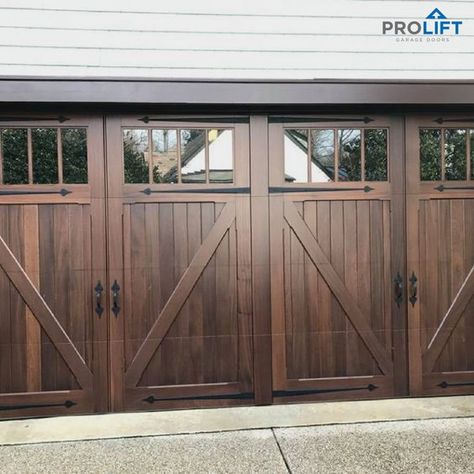 With a handsome and rich color, these custom wooden garage doors by Artisan are VERY impressive. Notice the tall (and large) garage door windows - as well as the custom hardware - for an authentic carriage house look. | Pro-Lift Garage Doors on Houzz | Photo and Project Credits: Pro-Lift Garage Doors Va Garage Doors With Windows, Wooden Garage Door, Doors With Windows, Garage Door Trim, Side Hinged Garage Doors, Faux Wood Garage Door, Carriage House Garage Doors, Garage Door House, Carriage House Doors