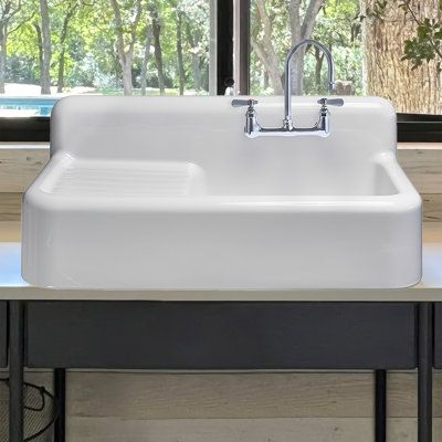 Handcrafted from natural clay, this sink is meticulously moulded and baked to achieve a smooth and glossy finish, exuding timeless sophistication. With its integral drainboard and high backsplash, this fireclay sink provides added convenience and style, making it a practical and stylish choice for any kitchen or utility space. 42" front apron single bowl fireclay kitchen/utility sink with integral drainboard and high backsplash. | Whitehaus Collection 42" Single Bowl Fireclay Utility Above Mount Vintage Sinks Kitchen, Washboard Sink, Farmhouse Sink With Drainboard, Kitchen Sink With Drainboard, Bathtub Alcove, Granny Cottage, Vintage Farmhouse Sink, Utility Space, Drainboard Sink