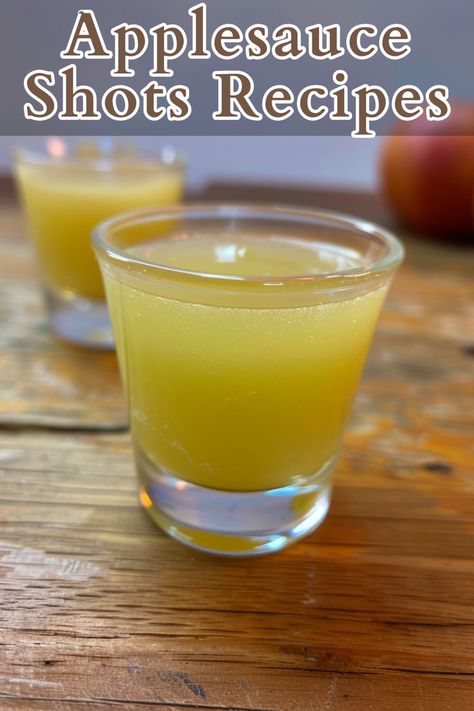 Applesauce Shots are a fun and fruity cocktail that combines the sweet and tangy flavors of apple and pineapple with a spicy kick. Made with Apple Pucker, pineapple juice, Fireball cinnamon whiskey, and hard apple cider, these shots are perfect for parties or casual gatherings. Fireball And Pineapple Juice, Shots With Pineapple Juice, Applesauce Shot, Apple Pucker, Alcoholic Punch Recipes, Cinnamon Whiskey, Fruity Cocktail, Hard Apple Cider, Alcoholic Punch