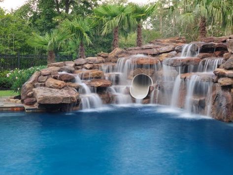 Love all the rocks and waterfalls... along with the tube slide. Swimming Pool Caves and Pool Cave Slides | Platinum Pools Pool With Waterfall, Barbacoa Jardin, Swimming Pool Pictures, Amazing Swimming Pools, Rock Waterfall, Indoor Pools, Luxury Swimming Pools, Pool Picture, Piscina Natural