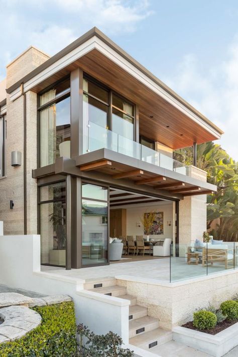 This modern West Coast home features gorgeous stone and smooth stucco walls as well as an open concept for indoor/outdoor seating. Seaside House Exterior, Neutral Transitional Living Room, Smooth Stucco, Stucco And Stone Exterior, West Coast Modern, Modern Exteriors, Custom Bunk Beds, Hgtv Designers, Stone Exterior