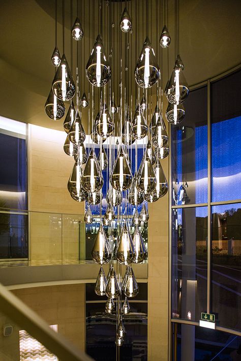 Fluid Chandelier for the Conrad on Behance Futuristic Chandelier, Lighting Installation, Space Architecture, Wall Fixtures, Light Installation, The Natural, Hanging Lamp, Natural Light, At Night