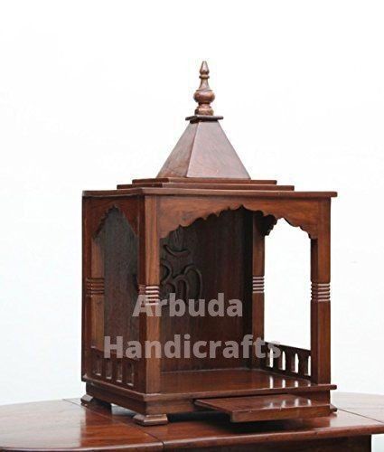 This is a semi-carved open house temple that is made up of seven wood. It has one tray . It's finishing is done in brown polished which gives it an elegant look. House Temple, Small Temple, Puja Mandir, Hand Carved Furniture, Buddha Garden, Mandir Design, Temple Design For Home, Indian Handicrafts, Pooja Mandir