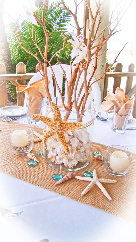 # starfish # burlap beach centerpiece Boho Beach Table Decor, Ocean Table Decorations, Simple Beach Centerpieces, Beach Theme Wedding Reception Tables Centerpiece Ideas, Beach Reception Centerpieces, Beach Theme Centerpieces Dollar Stores, Sea Shell Center Piece, Beach Sand Centerpieces, Reception Centerpiece Ideas