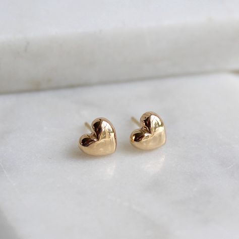 A beautiful pair of solid gold tiny heart stud earrings created by Lime Tree Design. The small size of these simple earrings means they are easy to wear both during the day and in the evening. The great advantage of solid gold is that it will not fade or tarnish and will remain beautiful forever. The earrings come boxed.  The charm, post and backs are made from 14ct solid gold. Please rub with a gold or lint free cloth to clean. Our gold is hallmarked with the Lime Tree Design hallmark at Birmin Curated Ears, Small Earrings Gold, Gold Heart Stud Earrings, Nose Ring Jewelry, Lobe Piercings, Simple Gold Earrings, Gold Heart Studs, Gold Heart Earring, Lime Tree