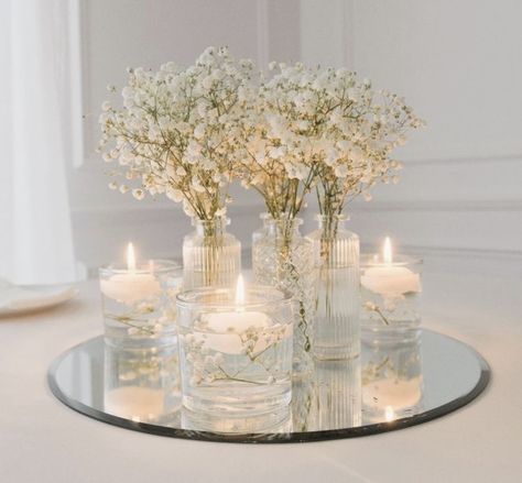 Baby's Breath And Candles Centerpiece, Wedding Glam Decor, Wedding Table Decorations Round Tables Candles, Simple Elegant Flower Centerpieces, Mirror Wedding Table Decor, Homemade Centerpieces Wedding, Wedding Round Centerpieces, Simple Wedding Centrepieces Round Tables, Candle And Flower Centerpieces Round Table