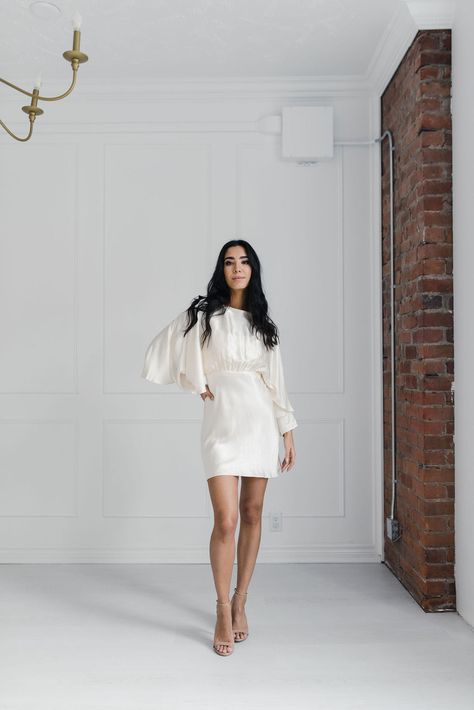 Easily the most versatile piece in your wedding wardrobe, the Shona Joy La Lune Open Back Curved Sleeve Mini Dress is the perfect mini to dress up or dress down. Made from the brand's signature (and sustainable) silk touch fabric, this mini makes a statement with gorgeous overstated sleeves, an open back and subtle but Shona Joy La Lune, Bridal Wardrobe, Chiffon White Dress, Wedding Wardrobe, Backless Midi Dress, Corset Midi Dress, The In Between, Chic Brides, White Linen Dresses