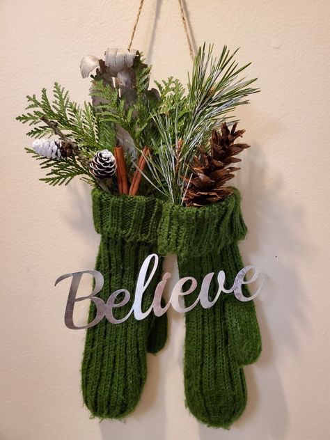 Repurposed an old pair of mittens into this festive door hanger using live pine and cedar sprigs and some pine cones! Mittens Door Hanger, Mitten Door Hanger, Mitten Decorations, Pinecone Wreaths, Craft Night Ideas, Minimalist Christmas Decor, Cotton Boll, Christmas Door Wreaths, Holiday Decor Ideas