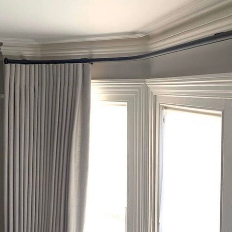 Bay windows can often be tricky when it comes to window treatments. A bespoke bending service gives you the option to apply a curtain pole to the window.  Bradley Collection Gliderpole, custom bent for this bay, with Pebble finials and a bespoke finish. #trickywindow #baywindow #curtainpole Bay Window Bedroom, Bay Window Curtain Poles, Ripplefold Curtains, Bay Window Treatments, Bay Window Living Room, Wooden Curtain Poles, Bay Window Curtain, Modern Window Treatments, Bay Window Curtains