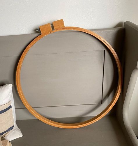 When I found a large wooden quilt hoop at Goodwill, I decided that it would make a great art frame. Here is the 19" quilt frame I purchased at Goodwill in a lighter wood tone stain. First, I wiped down the two hoops with a rag and hot soapy water. Then, I brushed Minwax Gel Stain in Walnut on the larger, outer hoop to darken it up. I left it to dry overnight. I pulled out my large DecoArt Mandala 18" x 18" Stencil and taped it on a square of burlap f… Minwax Gel Stain, Quilt Frame, Stenciled Wall Decor, Wooden Quilt, Large Scale Wall Art, Organized Clutter, Anthropologie Candle, Quilting Hoops, Large Glass Jars