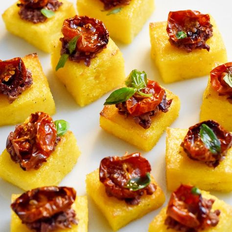 Up your vegan canapé game with these crispy polenta bites. They're packed full of flavour, easy to make and are a hit with every dinner guest. Winning combination for an easy vegan appetiser. } Polenta Appetizer, Polenta Squares, Polenta Bites, Crispy Polenta, Grilled Polenta, How To Cook Polenta, Party Bites, Slow Roasted Tomatoes, Peanut Dipping Sauces