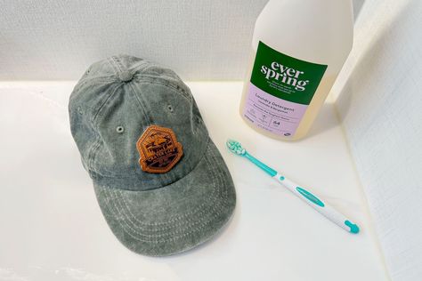 How to Wash a Baseball Hat So It Doesn’t Lose Its Shape How To Clean A Baseball Hat, Clean Baseball Hat, How To Clean A Baseball Caps, Best Way To Clean Hats Baseball Caps, Cleaning Hats Baseball Caps, Washing Hats Baseball Caps, Handwashing Clothes, Best Laundry Detergent, Old Washing Machine