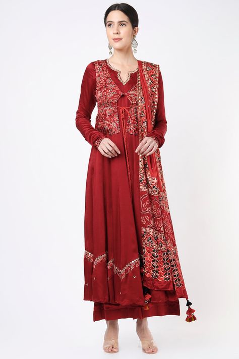 Featuring a red anarkali in modal satin base with mirror embroidery. It is paired with a contrasting ajrakh printed and tasseled waistcoat, palazzo pants, and a dupatta.  FIT: Fitted at bust and waist. COMPOSITION: Modal satin. CARE: Dry clean only. Ajrakh Dupatta, Red Anarkali, Mirror Embroidery, Embroidered Anarkali, Red Mirror, New Address, Indian Fashion Designers, Change Of Address, Pernia Pop Up Shop