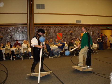 Jousting at Medieval Feast activity. Plywood circles for the platforms. Jousting stick is pvc pipe with a nerf ball glued on, covered with fabric gray taped to the pvc pipe. Medieval Party Games For Adults, Medieval Times Party Ideas, Medieval Games Diy, Medieval Party Games, Medieval Times Decorations, Medieval Parade Float, Medieval Party Ideas, Medieval Feast, Medieval Banquet