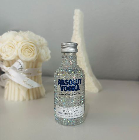 Bedazzled/Blinged/Rhinestone Mini Vodka Bottle Decanter Bottle comes empty - you can choose to fill it or use it as decor! More colors/styles will be stocked! If you have a specific color/style in mind, please feel free to send me a message and I'll try my absolute best to make it happen! All rhinestones are placed by hand. Because this item is handmade, there may be minor cosmetic imperfections. Also for this reason, no two items are identical and will have minor differences. Each item is unique! Please feel free to message me with any questions about the item and custom requests. Bedazzled Jack Daniels Bottle, Bedazzled Malibu Bottle, Decorated Vodka Bottle, Absolute Vodka Bottle, Malibu Bottle, Rhinestone Bottle, Jai Mala, Bedazzled Bottle, Mini Alcohol Bottles