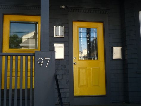 Mellow yellow Josephine Avenue entrance Black House With Yellow Door, Brown House Yellow Door, Black House Yellow Door, Grey House Black Trim, Charcoal House, Exterior House Paint Color, Paint Color Combinations, Yellow Front Doors, Exterior House Paint