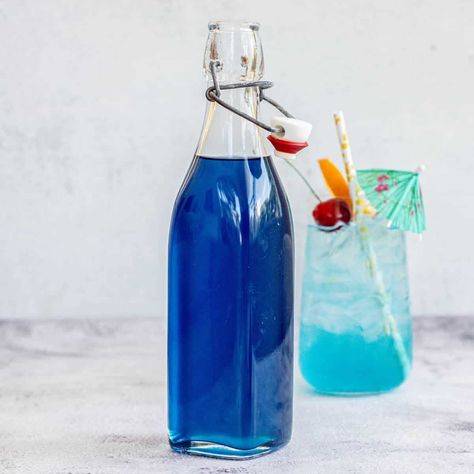 Blue Hawaiian Mocktail, Blue Curacao Recipe, Hawaiian Mocktail, Cardamom Simple Syrup, Cherry Simple Syrup, Blue Curacao Drinks, Fun Party Crafts, Pina Colada Mocktail, Spiced Cocktail