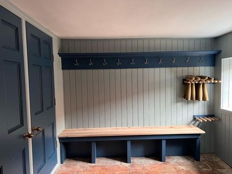 Tim hughes on Instagram: "The Boot Room. I’ve just completed this boot room at the stunning @westgate_farm_walsingham We worked together to design a useful space that included a utility area, boot & coat wall and a large cleaning cupboard. All of the units and oak worktops were made in my workshop in Snettisham. We found two perfect reclaimed doors and Sophie and Mikey found a lovely Belfast sink @norfolk_reclaim_ I’ve included a few before and after shots so you can see the transformation. T Boot Room In Garage, Garage Boot Room, Mini Boot Room, Boot Room Design, Blue Boot Room, Panelled Wall With Coat Hooks, Howdens Boot Room, Narrow Boot Room, Panelled Boot Room