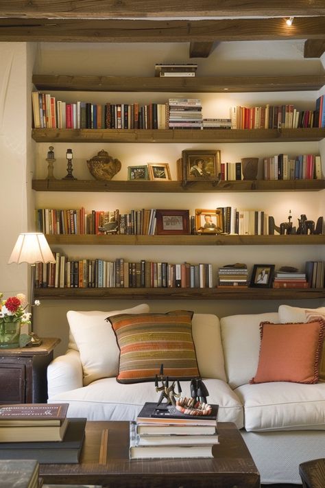 Floating Shelves Media Wall, Library Organization Ideas Home, Full Wall Bookshelves, Bookshelves On Wall, Modern Library Design Home, Bookshelf Behind Couch, Modern Shelving Ideas, Full Wall Shelving, Shelving Unit Ideas